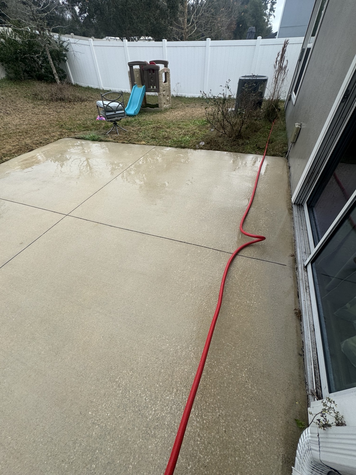 Clean backyard concrete patio after pressure washing